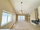 Bright living room featuring vaulted ceilings and fireplace at 3523 Calf Roper Ct, North Las Vegas, NV 89032