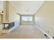 Spacious living room with a fireplace and large window views at 3523 Calf Roper Ct, North Las Vegas, NV 89032
