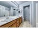 Spacious bathroom featuring a double sink vanity, large mirror, and shower at 3604 Cantura Crest Ct, North Las Vegas, NV 89031