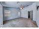 Spacious primary bedroom featuring a ceiling fan, carpet flooring, and natural light at 3604 Cantura Crest Ct, North Las Vegas, NV 89031