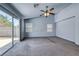 Vaulted ceiling bedroom with a ceiling fan and sliding glass doors leading to the backyard at 3604 Cantura Crest Ct, North Las Vegas, NV 89031
