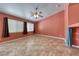 Spacious bedroom with a ceiling fan, tile flooring, and window with blinds at 3604 Cantura Crest Ct, North Las Vegas, NV 89031