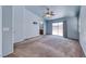 Large primary bedroom with a ceiling fan, ensuite bathroom, and sliding glass door to the backyard at 3604 Cantura Crest Ct, North Las Vegas, NV 89031