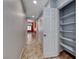 Bright hallway boasts tile flooring, storage closet, and leads to a living space at 3604 Cantura Crest Ct, North Las Vegas, NV 89031