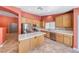 Well-equipped kitchen with stainless steel appliances, tile countertops, and ample cabinet space at 3604 Cantura Crest Ct, North Las Vegas, NV 89031