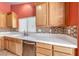 Modern kitchen featuring a stainless steel dishwasher and countertop space at 3604 Cantura Crest Ct, North Las Vegas, NV 89031