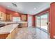 Eat-in kitchen with stainless steel appliances, ample counter space, and a sliding door to the backyard at 3604 Cantura Crest Ct, North Las Vegas, NV 89031