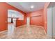 Bright living room with tile flooring, doorway arches, and natural light at 3604 Cantura Crest Ct, North Las Vegas, NV 89031