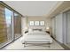 Inviting bedroom with floor-to-ceiling windows offering stunning city views, complemented by neutral tones at 3722 Las Vegas Boulevard S Blvd # 2609, Las Vegas, NV 89158