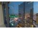 Stunning Las Vegas city view from a luxury high-rise condo through expansive windows, offering dazzling nighttime scenery at 3722 Las Vegas Boulevard S Blvd # 2609, Las Vegas, NV 89158