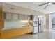 Modern kitchen with stainless steel appliances, light wood cabinets, and an expansive countertop at 3722 Las Vegas Boulevard S Blvd # 2609, Las Vegas, NV 89158