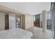 Bright main bedroom with sleek cabinets, hardwood floor, and city views from large windows at 3722 Las Vegas Boulevard S Blvd # 2609, Las Vegas, NV 89158
