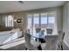 Stylish dining area with a glass-top table and upholstered chairs, next to the living room and offering great views at 3921 Painted Lady Ave, Las Vegas, NV 89141