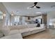 Comfortable living room featuring a large white sectional sofa and stylish decor, perfect for relaxing or entertaining guests at 3921 Painted Lady Ave, Las Vegas, NV 89141