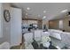 Open-concept living space featuring a modern kitchen, dining area, and comfortable living room for seamless everyday living at 3921 Painted Lady Ave, Las Vegas, NV 89141