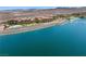 Beautiful lakefront condominiums with a pool and private boat docks against a backdrop of desert landscape at 4 Via Centrale # 1, Henderson, NV 89011