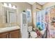 Bathroom featuring tile floors, a granite countertop, modern decor, and a window with natural lighting at 4 Via Centrale # 1, Henderson, NV 89011