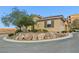 Charming home featuring a well-maintained yard with natural rock landscaping at 4 Via Centrale # 1, Henderson, NV 89011