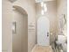 An elegant entryway with arched doorway and stylish lighting at 4 Via Centrale # 1, Henderson, NV 89011