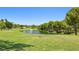 Scenic view of the golf course featuring a tranquil pond and well-manicured greens at 4 Via Centrale # 1, Henderson, NV 89011
