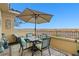 This patio features a table, seating, decor, and mountain views at 4 Via Centrale # 1, Henderson, NV 89011