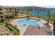 Aerial view of the community pool and spa surrounded by seating and landscaping at 4 Via Centrale # 1, Henderson, NV 89011