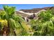 Waterfall feature surrounded by palm trees and desert landscaping at 4 Via Centrale # 1, Henderson, NV 89011