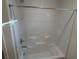 Bathroom features a tiled tub and shower combination with a chrome shower head and faucet at 4266 Yucca Brevi Ave, Las Vegas, NV 89139