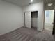Bedroom with carpet flooring and closet showcasing storage; doorway view into connecting room at 4266 Yucca Brevi Ave, Las Vegas, NV 89139
