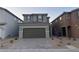 Charming two-story home featuring a paved driveway and a two-car garage at 4266 Yucca Brevi Ave, Las Vegas, NV 89139