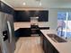Stylish kitchen features stainless steel appliances, and a large island with counter seating at 4266 Yucca Brevi Ave, Las Vegas, NV 89139