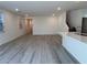 Open-concept living room featuring a kitchen island, tile floors and neutral paint palette at 4266 Yucca Brevi Ave, Las Vegas, NV 89139
