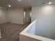Bright and airy upstairs landing with neutral carpet and a view of the hallway at 4266 Yucca Brevi Ave, Las Vegas, NV 89139