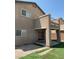 Home exterior showing a backyard with artificial turf, covered patio, and a second-story balcony at 5316 Fireside Ranch Ave, Las Vegas, NV 89131