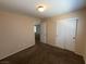 Cozy bedroom with carpet, closet with sliding doors, and view to the hallway at 5316 Fireside Ranch Ave, Las Vegas, NV 89131