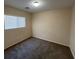 Bedroom featuring neutral walls, carpet flooring, and a window that provides natural light at 5316 Fireside Ranch Ave, Las Vegas, NV 89131