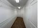 Walk-in closet with carpeted floors and shelving for storage at 5316 Fireside Ranch Ave, Las Vegas, NV 89131