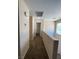 Upstairs hallway featuring neutral paint, carpet, and natural light from window at 5316 Fireside Ranch Ave, Las Vegas, NV 89131