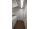 Bright laundry room with tile flooring, washer, dryer, and a doorway to the hallway at 5316 Fireside Ranch Ave, Las Vegas, NV 89131