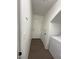 Laundry area with tile flooring, a washer, dryer, and a white door leading outside at 5316 Fireside Ranch Ave, Las Vegas, NV 89131