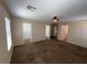 Carpeted main bedroom with ceiling fan, and attached walk-in closet at 5316 Fireside Ranch Ave, Las Vegas, NV 89131