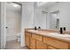 Bathroom featuring a double vanity, tile flooring, and a separate tub and toilet area at 5521 Jackpot Winner Ln # 101, Las Vegas, NV 89122
