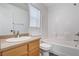 This bathroom features a single sink vanity and a shower-tub combo with tile surround at 5521 Jackpot Winner Ln # 101, Las Vegas, NV 89122