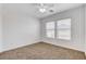 Bright bedroom with neutral carpet and two windows with horizontal blinds at 5521 Jackpot Winner Ln # 101, Las Vegas, NV 89122