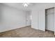The bedroom has neutral carpet, a closet with sliding doors and a ceiling fan at 5521 Jackpot Winner Ln # 101, Las Vegas, NV 89122
