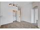 Bonus room featuring a laundry closet, carpet, overhead lighting, and ensuite access at 5521 Jackpot Winner Ln # 101, Las Vegas, NV 89122