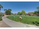 Neighborhood park featuring manicured lawns, walking paths, shade trees, and a playground area at 5521 Jackpot Winner Ln # 101, Las Vegas, NV 89122