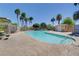 Community pool and deck with lush landscaping and comfortable seating at 5521 Jackpot Winner Ln # 101, Las Vegas, NV 89122