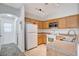 Well-lit kitchen features stainless steel appliances, light wood cabinets, and tile flooring at 5521 Jackpot Winner Ln # 101, Las Vegas, NV 89122