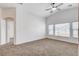 Spacious living room with lots of natural light, neutral walls, and carpet floors at 5521 Jackpot Winner Ln # 101, Las Vegas, NV 89122